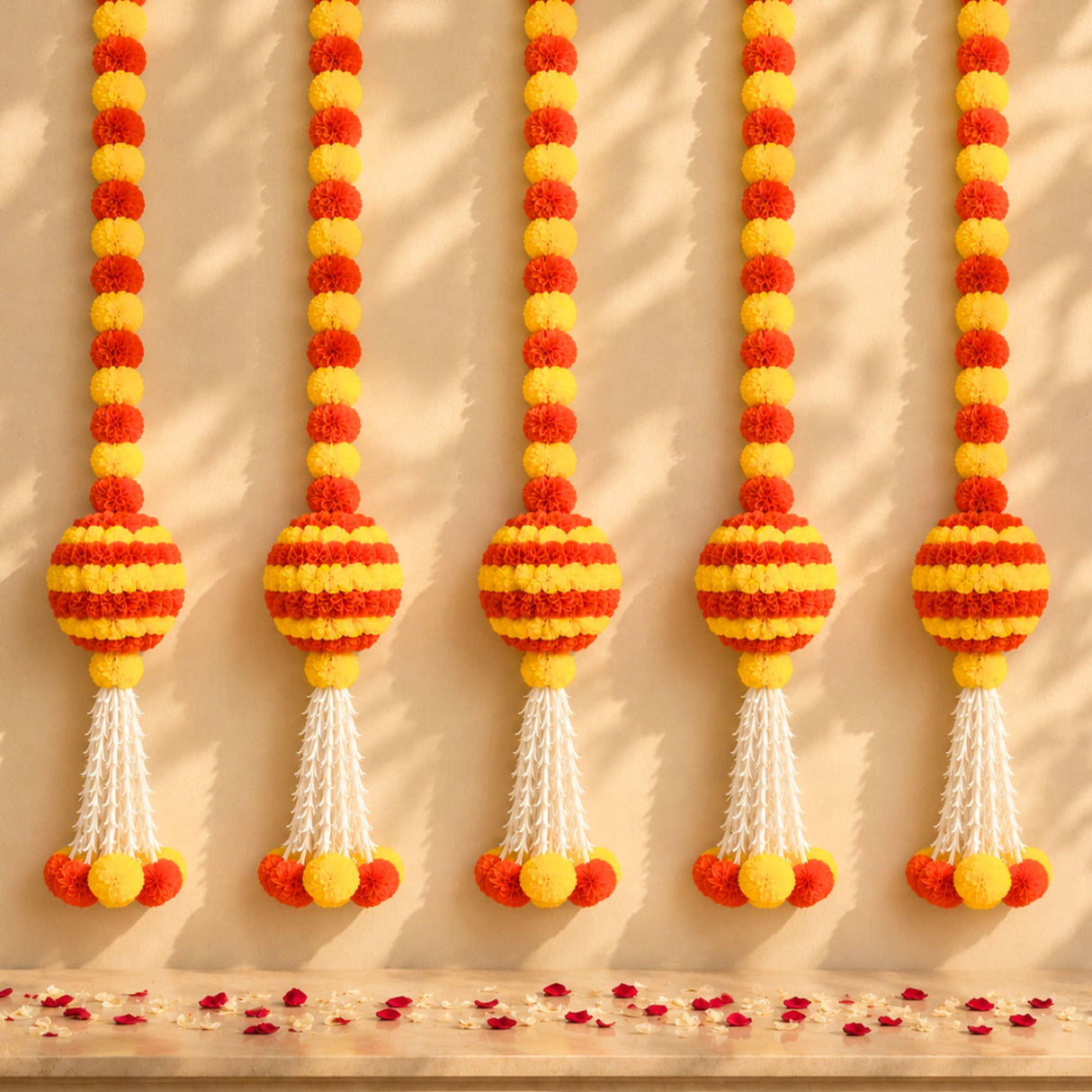 Marigold garland hanging jhoomer with vibrant orange and yellow pom-poms and white tassels for festive decor