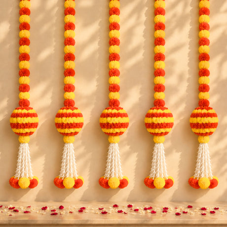 Marigold garland hanging jhoomer with vibrant orange and yellow pom-poms and white tassels for festive decor