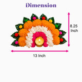 Vibrant orange white and pink artificial marigold flower rangoli mat with colorful pom-poms and golden candle holder for diwali decor
