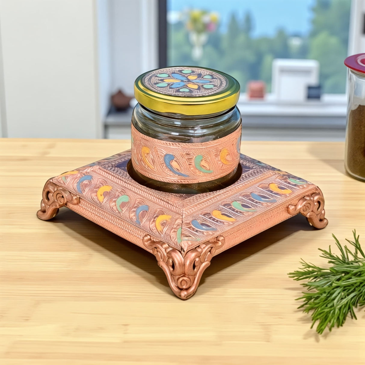 Copper-colored decorative jar stand with floral patterns and ornate legs for Dry Fruits Storage