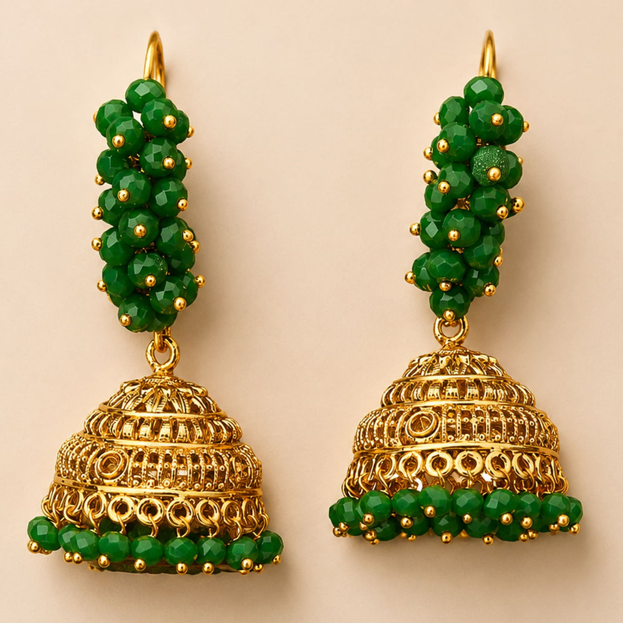 Elegant gold tone indian bali hoop and bead jhumka earrings with green filigree beads for diwali and wedding wear