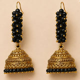 Elegant black and gold jhumka earrings with intricate filigree and faceted beads for traditional Diwali and wedding wear
