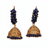 Golden jhumka earrings with deep blue beads and intricate filigree detailing for Diwali wedding and ethnic wear