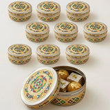 Silver-colored meenakari stainless steel round cookie tin with colorful floral and geometric enamel designs for sweets storage