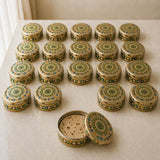Ornate gold-toned stainless steel roti box with green and blue mandala design open to reveal sponge inside