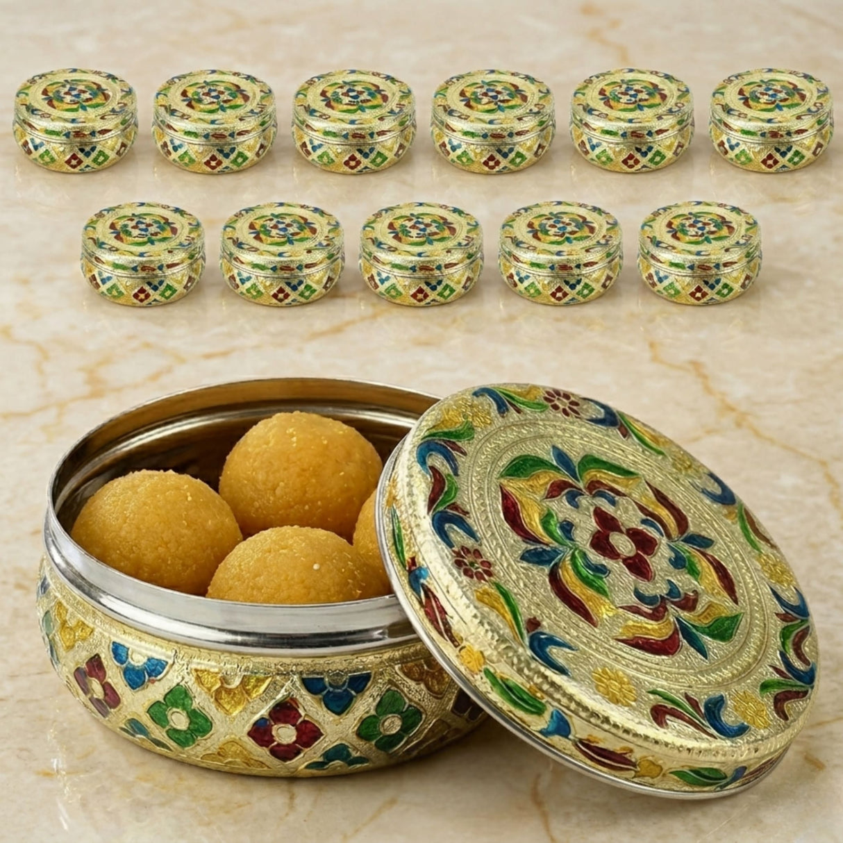 Meenakari stainless steel storage box with lid featuring ornate enamel floral patterns in gold green blue and red hues