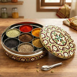 Ornate maroon gold Meenakari steel masala box with 7 spice compartments