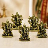 Golden brass metal ganesha idol with intricate detailing in traditional seated pose for home temple and festival decor