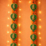 2 pcs metal leaf ganesha diwali decor wall hanging in green with golden ganesha figures and orange marigold flowers