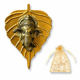 Metal leaf ganesha wall hanging decor featuring a golden metallic ganesha head pendant with intricate embossed patterns