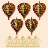 Metal leaf ganesha wall hanging decor featuring red glittery leaves and golden intricate ganesha faces for home and office