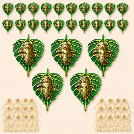 Metal leaf ganesha wall hanging decor featuring green leaf-shaped ornaments with golden ganesha faces on textured bases