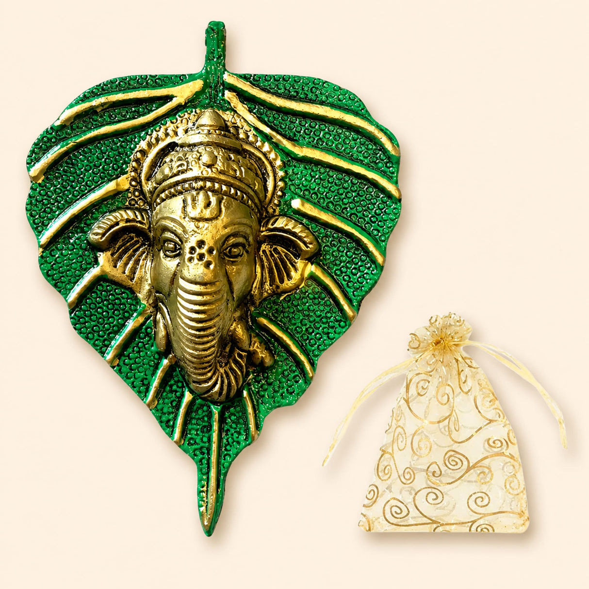 Golden ganesha head metal wall hanging mounted on textured green leaf plaque for home living room diwali decor