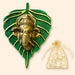 Golden ganesha head metal wall hanging mounted on textured green leaf plaque for home living room diwali decor