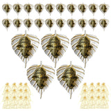 Golden ganesha head charms set on silver metal leaf bases decorative indian wall hanging for home and office decor