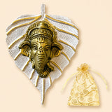 Golden ganesha metal wall hanging with intricate detailing on silver leaf background for home decor and festive gifts