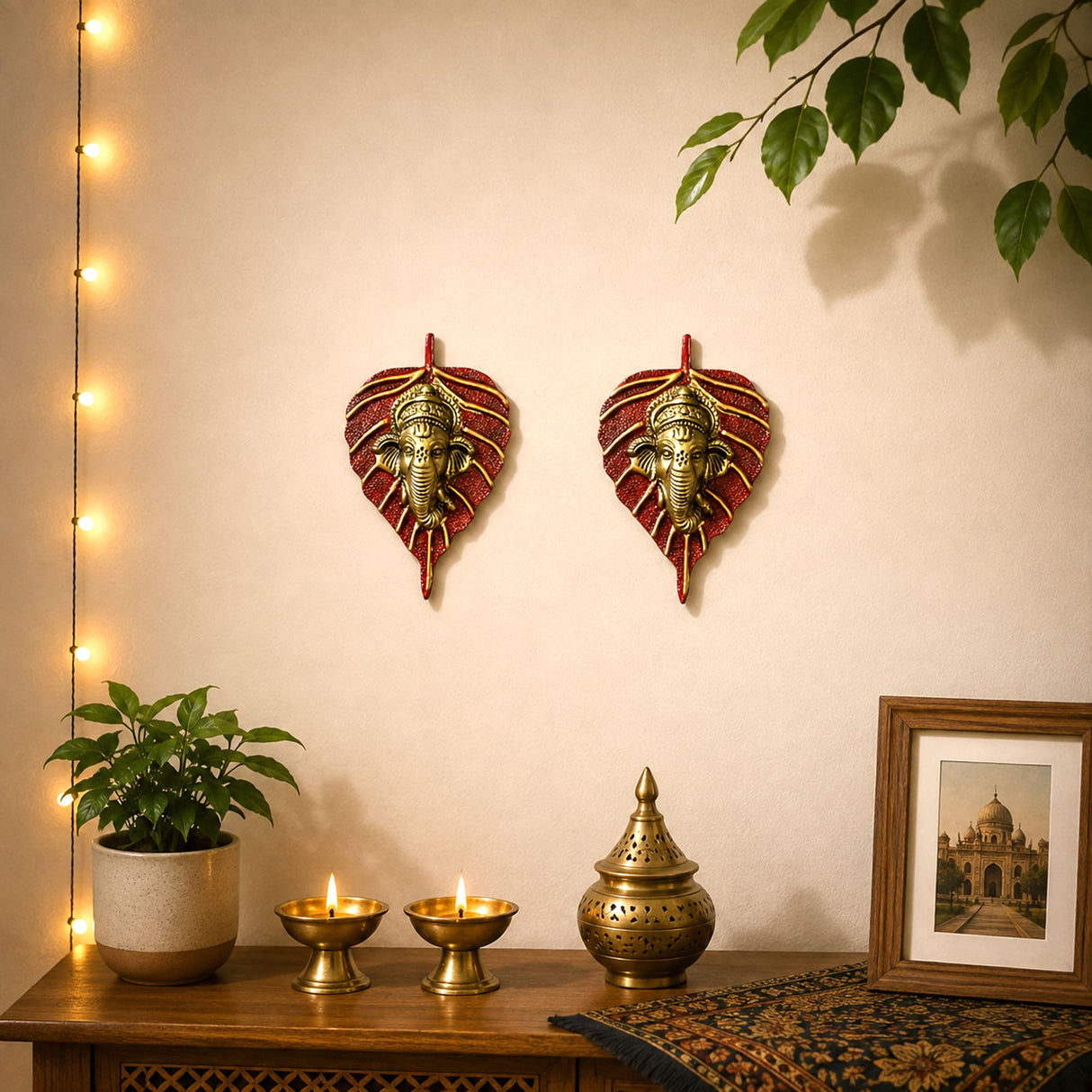 Metal leaf ganesha wall hanging decor with red and gold leaf shapes and brass ganesh head for home and office
