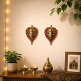 Metal leaf ganesha wall hanging decor with red and gold leaf shapes and brass ganesh head for home and office