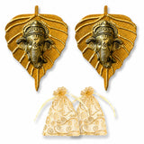 Golden metal leaf-shaped ganesha wall hanging decor featuring detailed faces for home living room office use