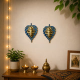 Metal leaf ganesha wall hanging decor featuring blue and gold leaf shapes with ganesha figures for home and office