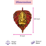 A golden ganesha figurine intricately detailed in a red metal leaf frame 2 pcs wall hanging for diwali decor and pooja favor