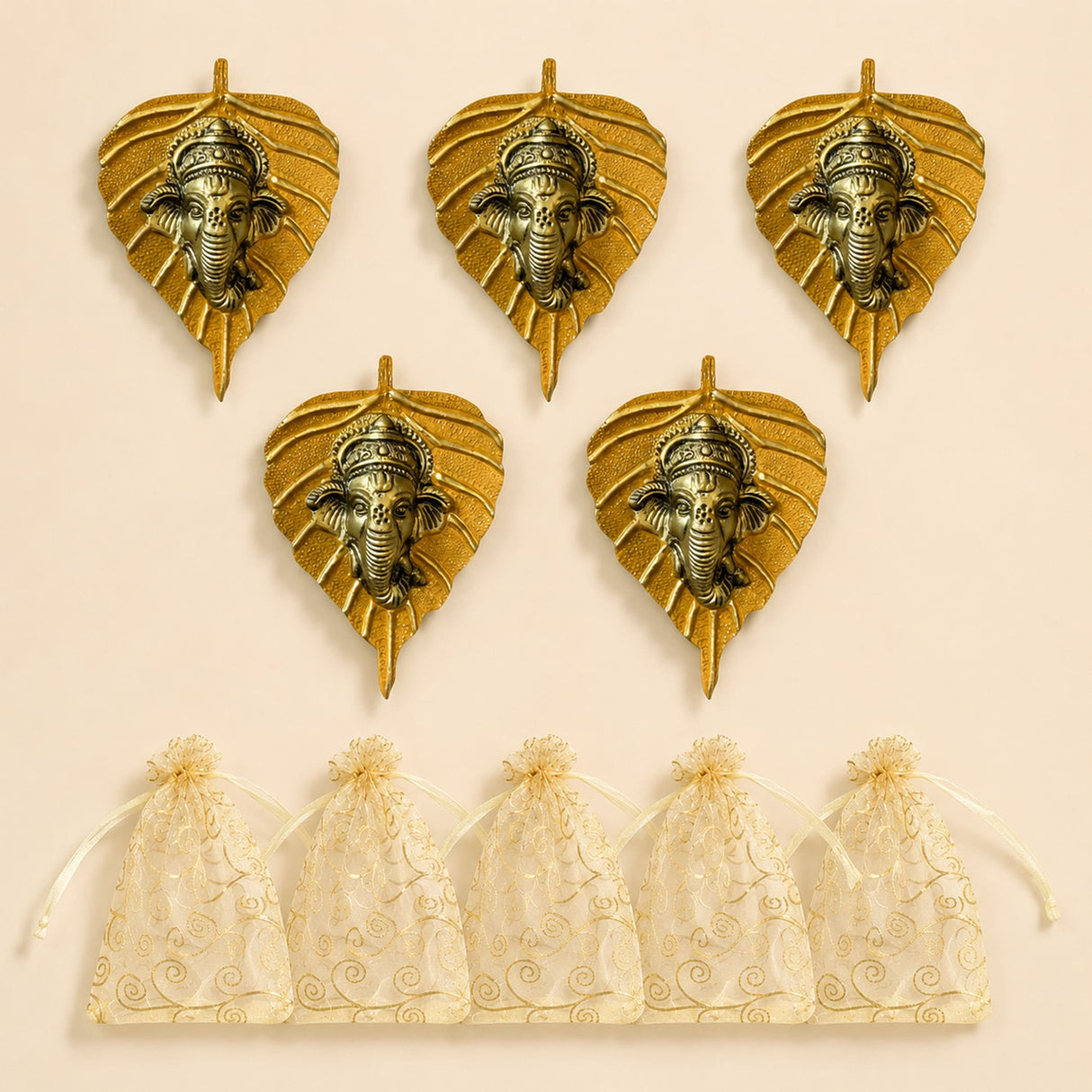 Golden metal leaf wall hanging decor featuring detailed ganesha heads in metallic finish for home and office use