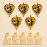 Golden metal leaf wall hanging decor featuring detailed ganesha heads in metallic finish for home and office use