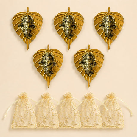Golden metal leaf wall hanging decor featuring detailed ganesha heads in metallic finish for home and office use