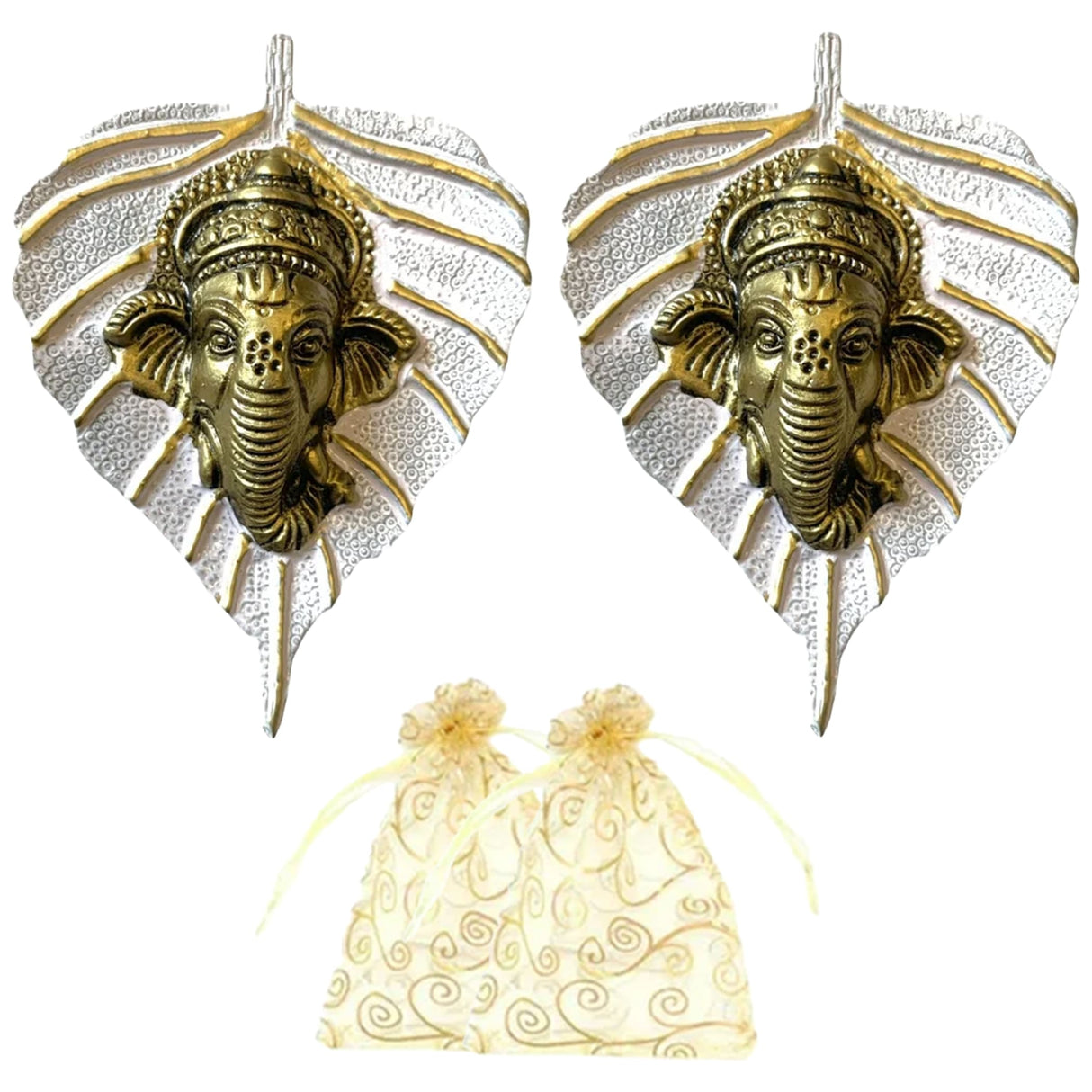 Golden ganesha head ornaments on silver leaf-shaped metal bases with decorative swirls for home and office decor