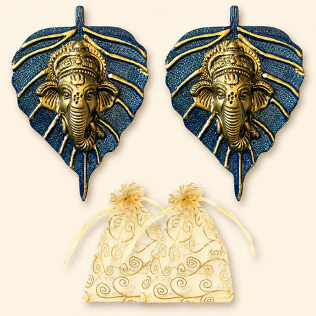 Metal leaf ganesha wall hanging decor featuring golden ganesha faces on blue leaf-shaped bases with gold accents