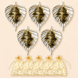 Set of five ornate brass ganesha head wall hangings with silver leaf designs and matching cream organza gift bags