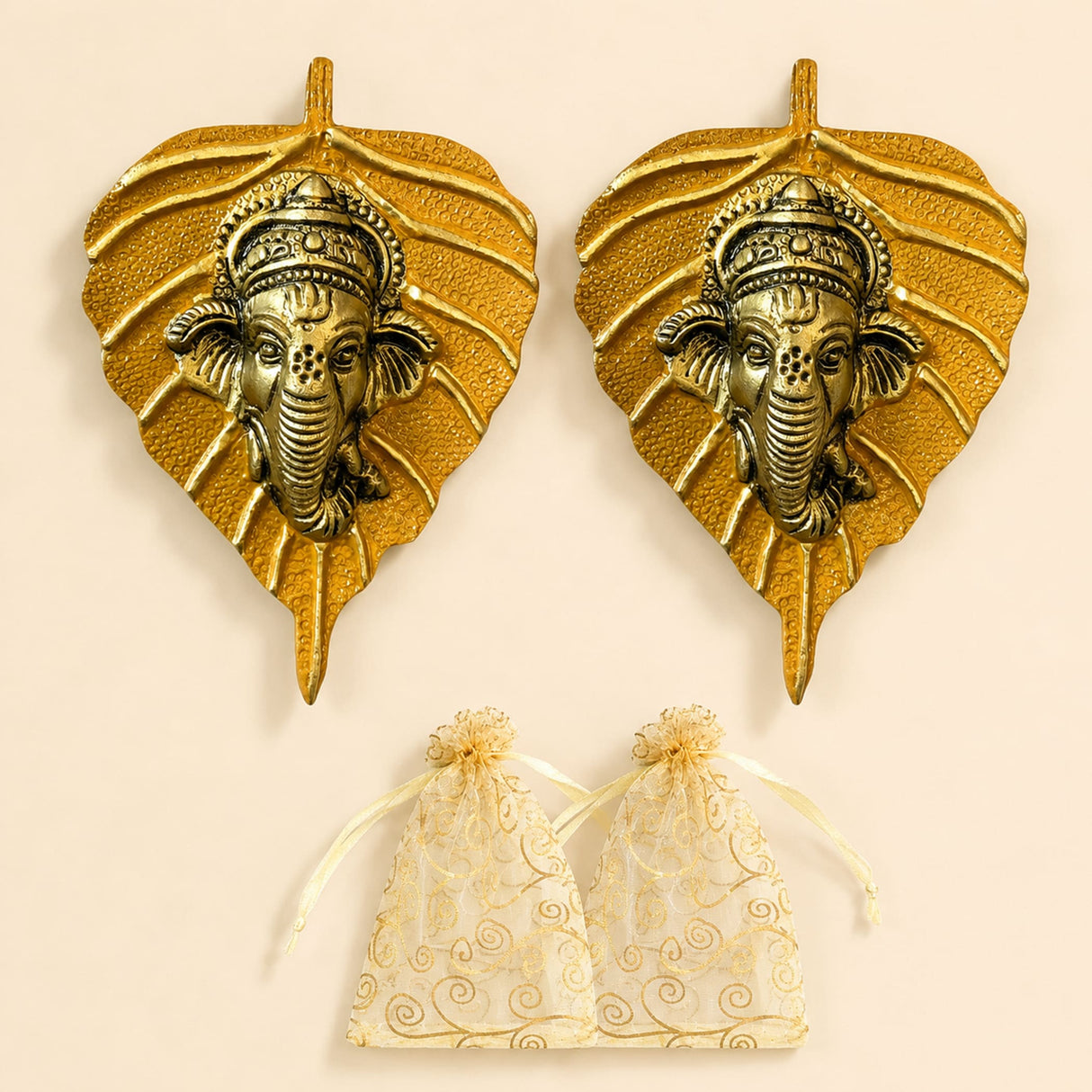 Metal leaf ganesha wall hanging decor in golden metal featuring detailed ganesha head carvings for home and office use