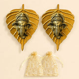 Metal leaf ganesha wall hanging decor in golden metal featuring detailed ganesha head carvings for home and office use