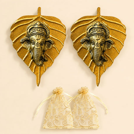 Metal leaf ganesha wall hanging decor in golden metal featuring detailed ganesha head carvings for home and office use