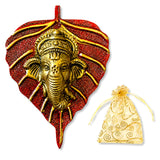 Metal leaf ganesha wall hanging decor featuring a golden ganesha figure on a textured red leaf background for home use