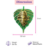 Golden ganesha metal wall hanging decor intricately carved within textured green leaf frame for home and office use