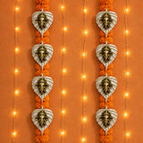 Heart-shaped metal leaf ganesha wall hanging decor with bronze deity figures and orange marigold garlands for diwali and home use