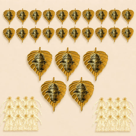 Golden metal leaf-shaped wall hanging decor with intricate ganesha head carvings for home living room and office use