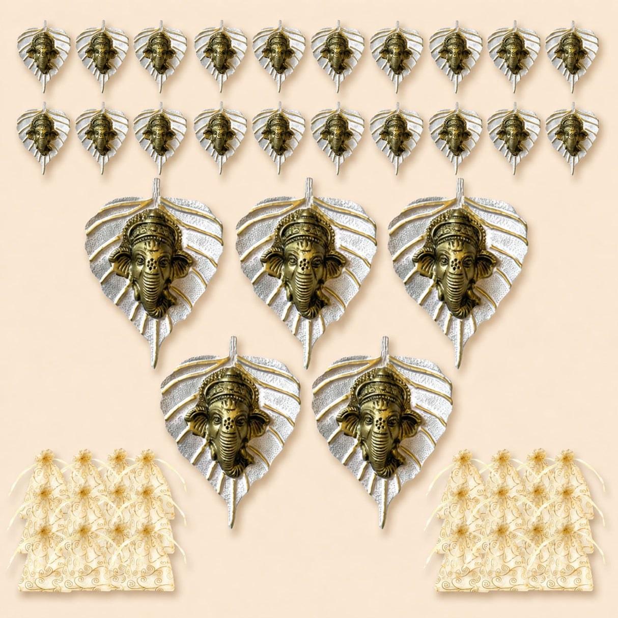 Bronze-colored ganesha head ornaments mounted on silver metal leaf backings for home decor and festive gifts