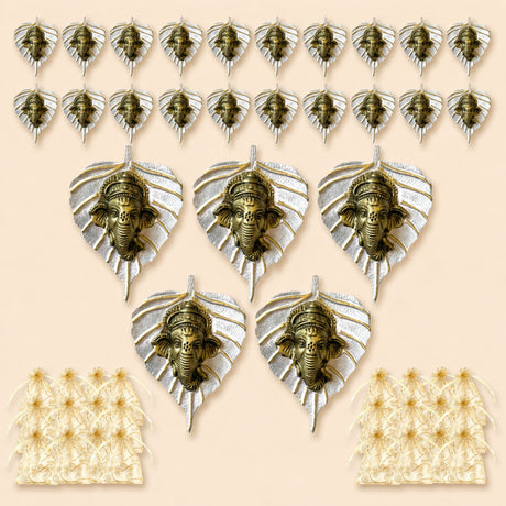 Bronze-colored ganesha head ornaments mounted on silver metal leaf backings for home decor and festive gifts