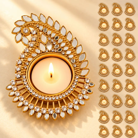 Gold-colored metal paisley design tea light candle holder with mirror and crystal embellishments for Diwali décor