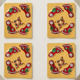 Metallic lakshmi charan paduka 2 pairs feet red and green with silver rhinestones on golden cards for diwali decoration