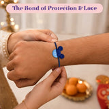 A blue mickey mouse-shaped charm rakhi bracelet with soft elastic band for brother symbolizing love and protection