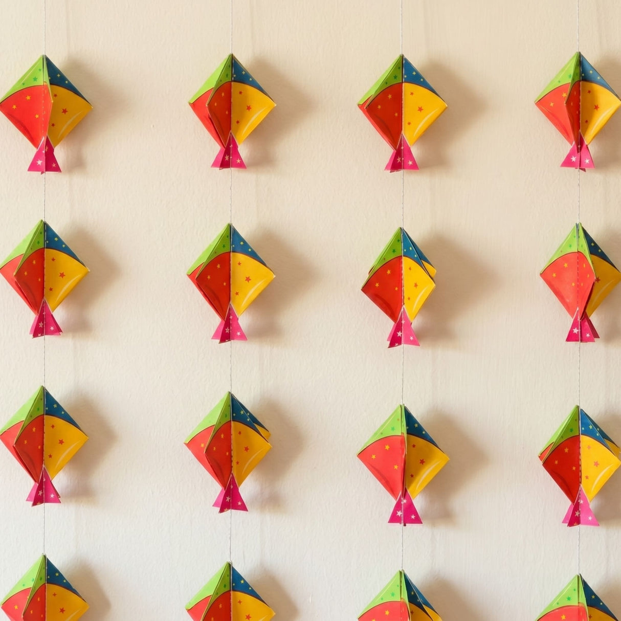Colorful paper kites in red yellow green and pink with star patterns happy makar sankranti mini kites frill set