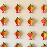 Colorful paper kites in red yellow green and pink with star patterns happy makar sankranti mini kites frill set