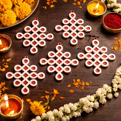 White and red wooden infinity knot diy small muggu kolam cutout decoration for indian pooja and wedding