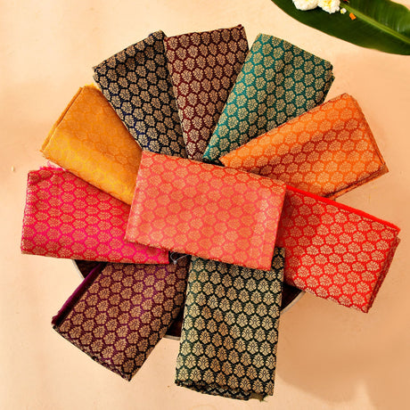 Unstitched multicolor blouse pieces in traditional brocade fabric with intricate metallic floral patterns for Indian occasions