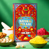 Vibrant red box of natural Holi gulal powder with peacock designs and greeting card