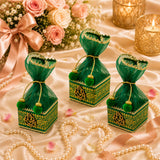 Pack of 4 small green and gold ornate potli gift boxes with sheer organza tops and golden string ties for Indian weddings