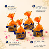 Pack of 4 small blue and gold net potli gift boxes with embroidered ganesha designs and orange organza ribbons for indian weddings and festivals